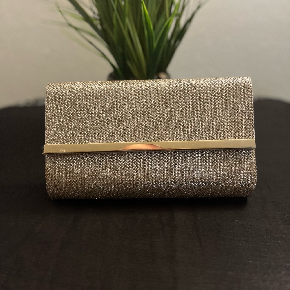 BARE MINERALS… Gold clutch w/magnetic closure.